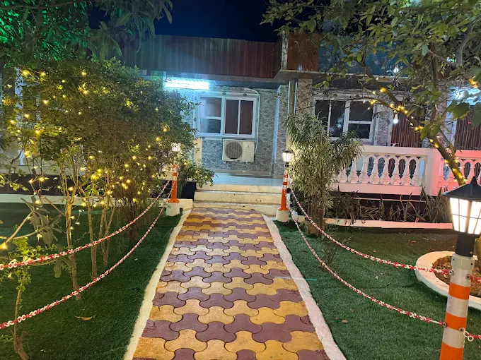 Illuminated garden walkway at Swiss Hotel Rooms